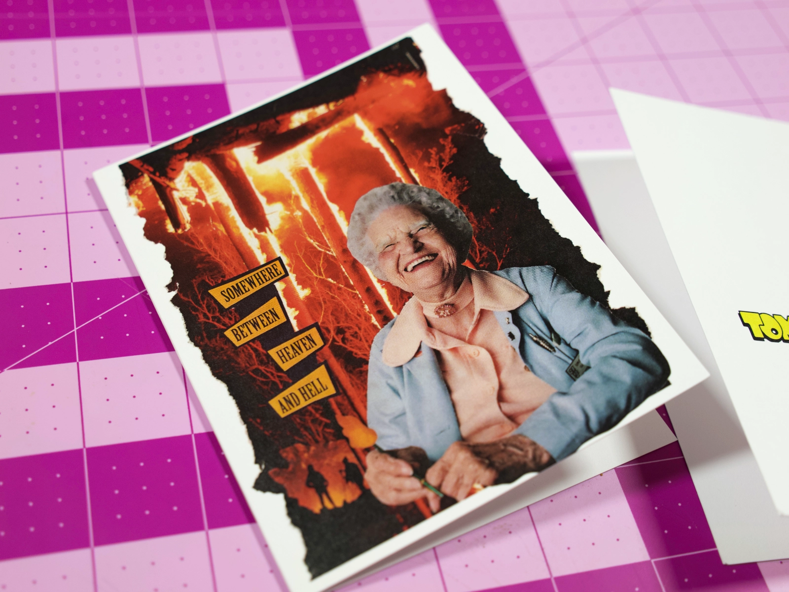 Two Somewhere Between Heaven and Hell greeting cards showing the front and back.